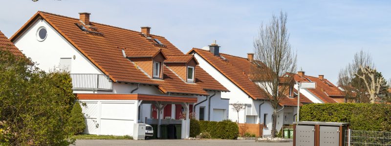 Classic german residential houses with orange roofing tiles and windows